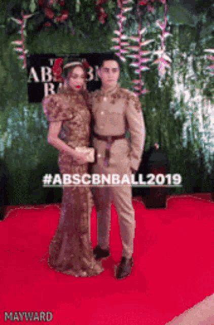 a couple posing for a picture on a red carpet with the words abscbnball 2019 on the bottom