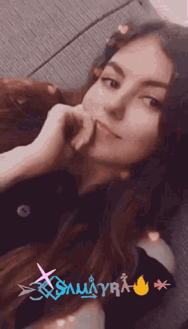 a woman is sitting on a couch with the word samurai on the bottom right