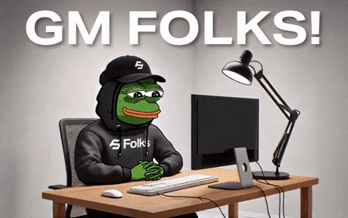 a cartoon frog is sitting at a desk in front of a computer with the words gm folks above him