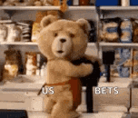 a teddy bear is standing in front of a shelf holding a gun .