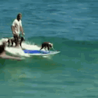 a man is riding a wave on a surfboard while another man watches