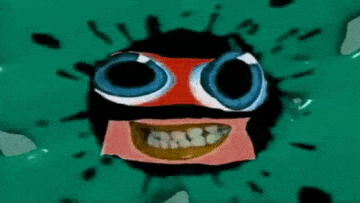 a close up of a cartoon character with big eyes and a smile .