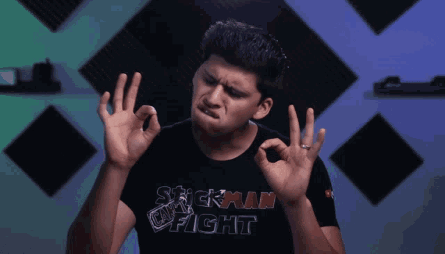 a man in a black shirt that says stickman fight
