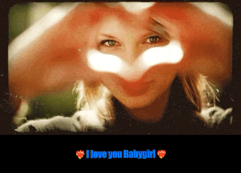 a woman making a heart shape with her hands and the words " i love you babygirl " below her
