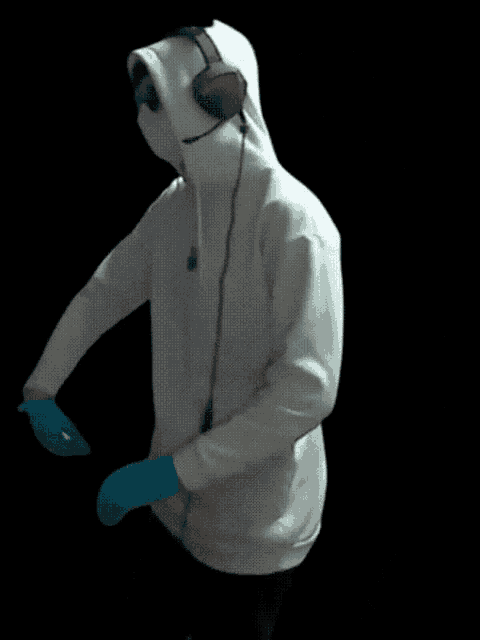 a person wearing a hoodie and headphones is dancing
