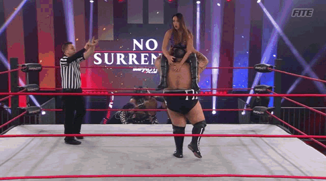 a wrestling ring with a sign that says " no surren " on it