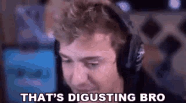 a man wearing headphones is sitting in front of a computer screen and saying `` that 's disgusting bro '' .