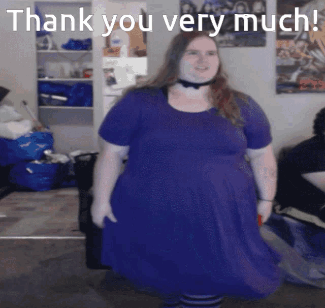 a woman in a purple dress stands in front of a sign that says " thank you very much "