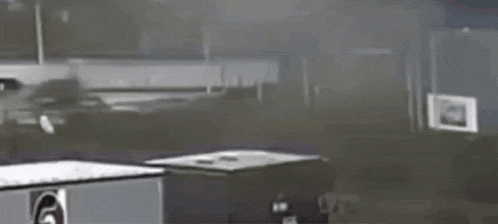 a black and white photo of a car with a smoke coming out of the window .