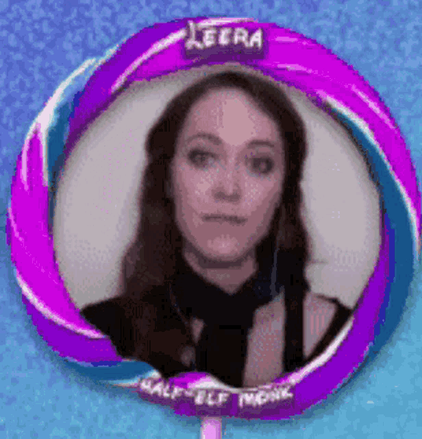 a picture of a woman in a purple circle with leera half elf monk on it