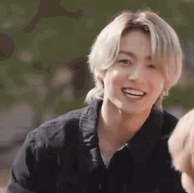 a close up of a person 's face with a smile on their face .