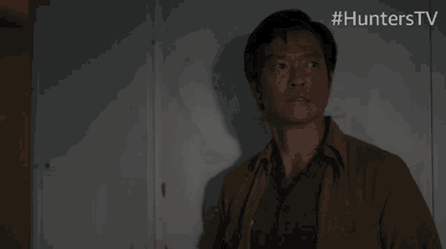 a man leaning against a wall with the hashtag #hunterstv on the bottom