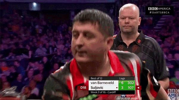 a man in a red and white shirt with the number 12 on it