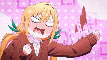 a girl in a brown sweater is making a funny face while holding a piece of chocolate
