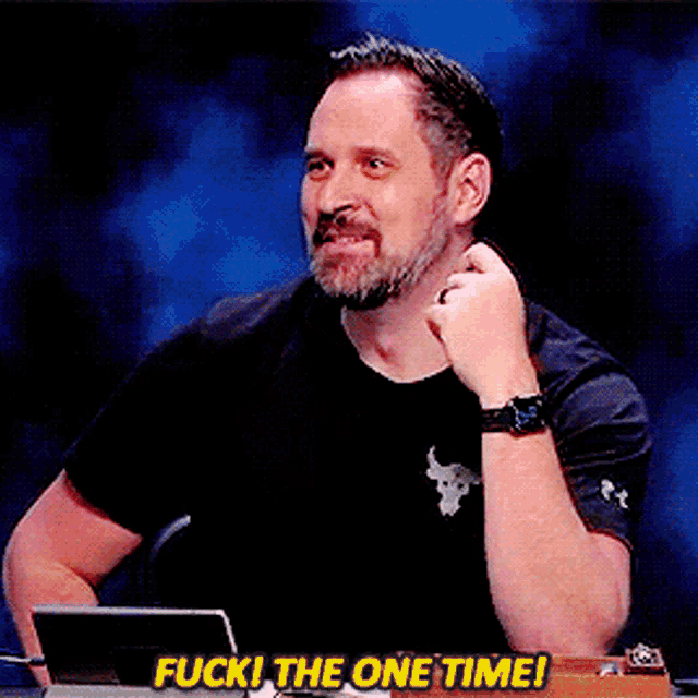 a man sitting in front of a laptop with the words " fuck the one time " above him