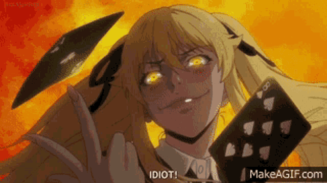 a girl is holding a playing card and making a face and says idiot