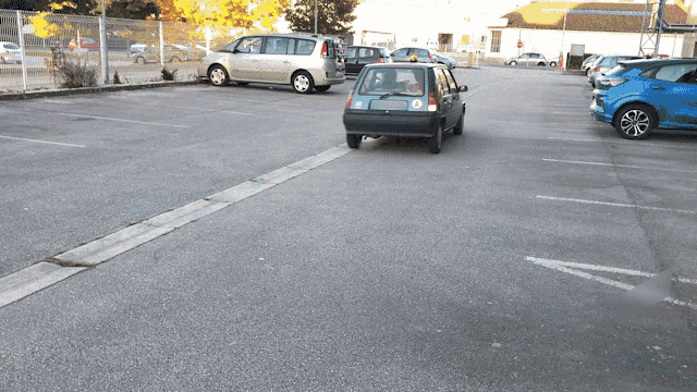 a small black car with a license plate that says o on it