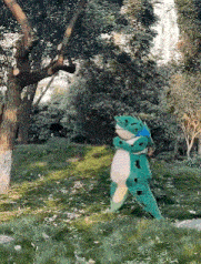 a stuffed animal in a frog costume is walking through the grass