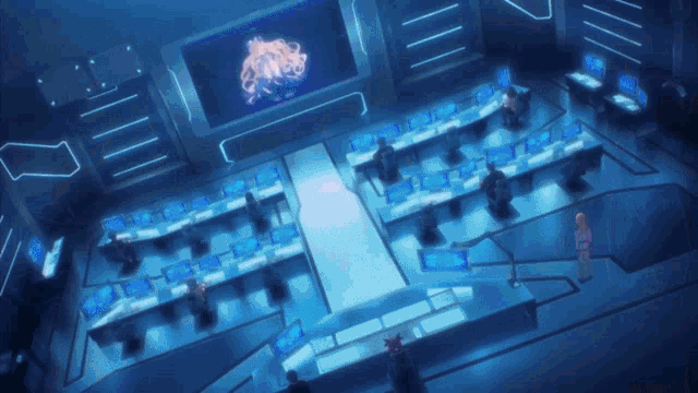 a room with a lot of computer monitors and a large screen that says ' ii ' on it