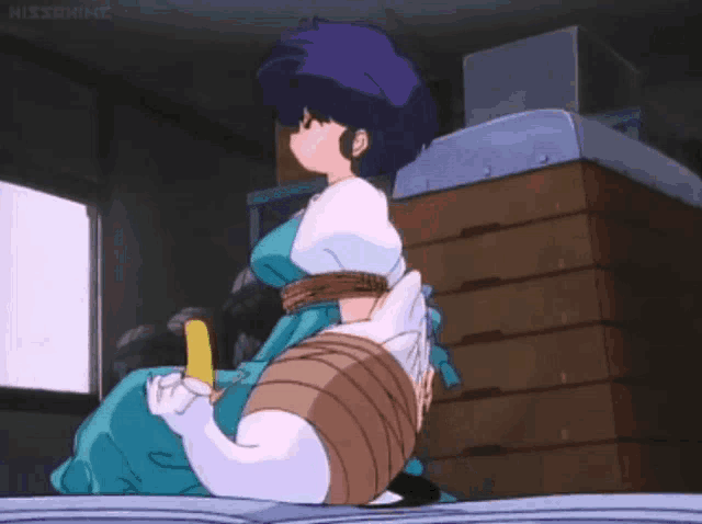 a girl in a blue dress is tied up with a cat