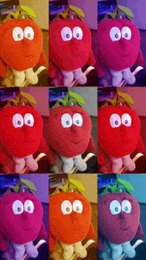 a bunch of stuffed tomatoes with big eyes are sitting on a table