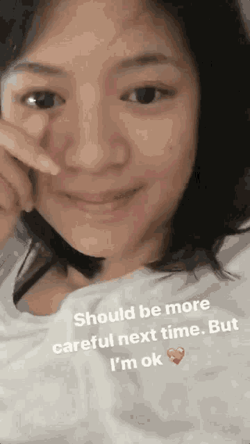 a close up of a woman 's face with the words should be more careful next time but i 'm ok below her