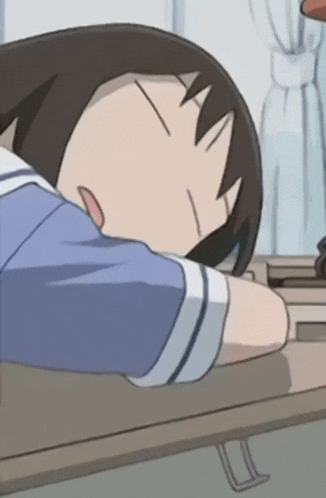 a cartoon girl sleeping on a desk with her eyes closed