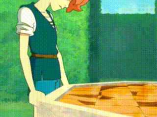 a man in a blue vest is standing next to a table with a bunch of food on it .