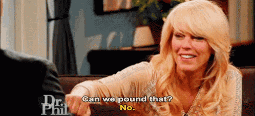 a woman is sitting on a couch talking to a man and asking if they can pound that .