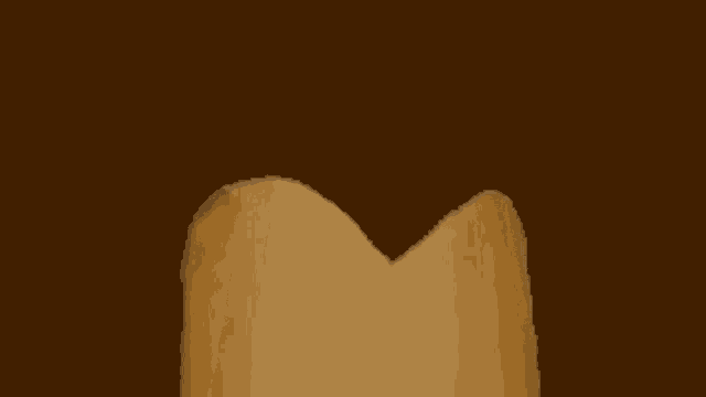 a piece of paper that looks like a heart is against a brown background .