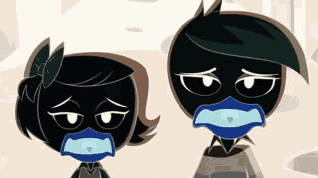 a boy and a girl are standing next to each other with their mouths tied