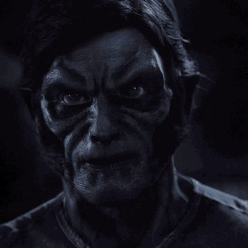 a close up of a man with red eyes