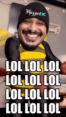 a man wearing a black hat with the letter x on it smiles and says lol lol lol lol lol lol lol lol lol lol lol lol