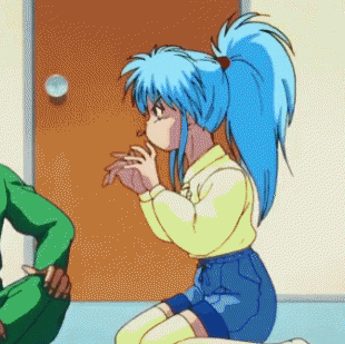 a girl with blue hair is kneeling down
