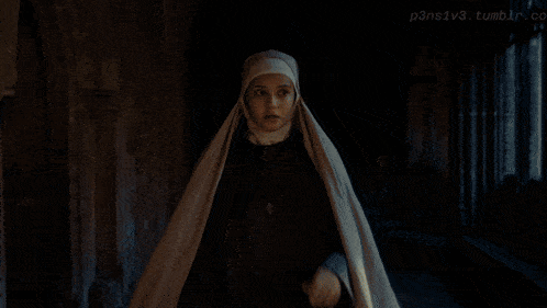 a nun is standing in a dark hallway with the words p3nslv3.tumblr.com above her