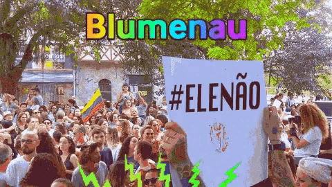 a group of people holding a sign that says blumenau #elenao