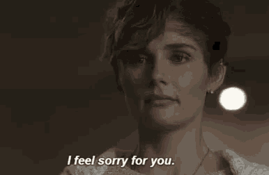 a woman is saying `` i feel sorry for you '' in a close up of her face .