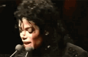 a close up of a person speaking into a microphone with the word jackson on the bottom right