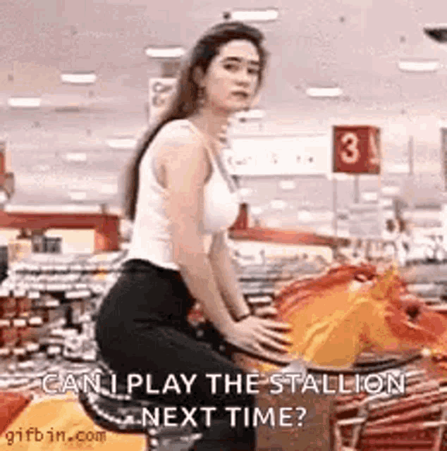 a woman is sitting on a horse in a shopping cart in a store .