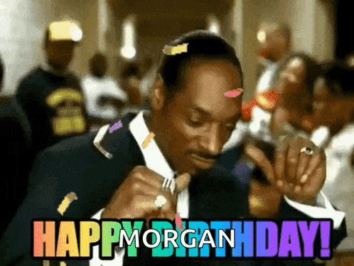 a man in a suit is celebrating his birthday with confetti and the words happy morgan birthday