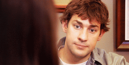 a close up of a man 's face with a woman behind him .