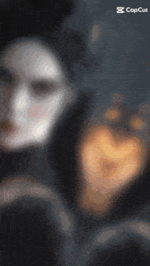 a blurred image of a person with a capcut logo