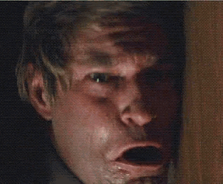 a close up of a man 's face with the word noo written above him