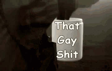 a person is holding a cup of coffee with the words `` that gay shit '' on it .