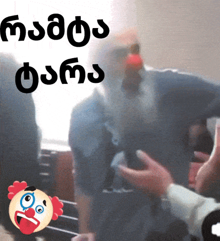 a clown giving a thumbs up next to a man with a beard in a blurry image