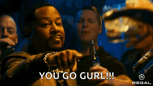a man holding a bottle of beer and saying you go gurl