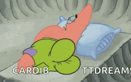 patrick star from spongebob squarepants is sleeping on a bed with pillows .