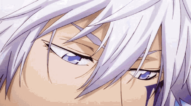 a close up of a person 's face with white hair and blue eyes