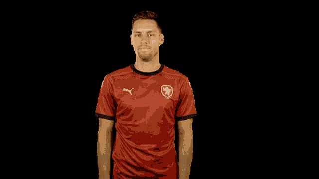 a man in a red shirt with a czech flag on it