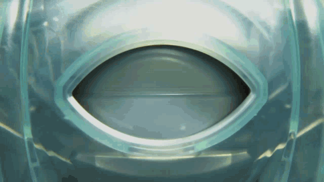 a clear plastic object with a hole in the middle of it
